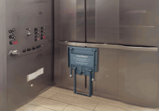 A Quick Seat Folding Chair Mounted inside an Elevator